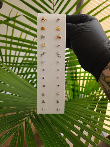 Explore book tattoo ideas for females, creative tattoo ideas in Nacogdoches, available at Primal Piercing & Jewelry