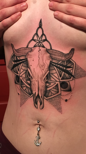 Explore back flower tattoo ideas, creative tattoo ideas in Kingsford, available at Deft Tattoo Studio