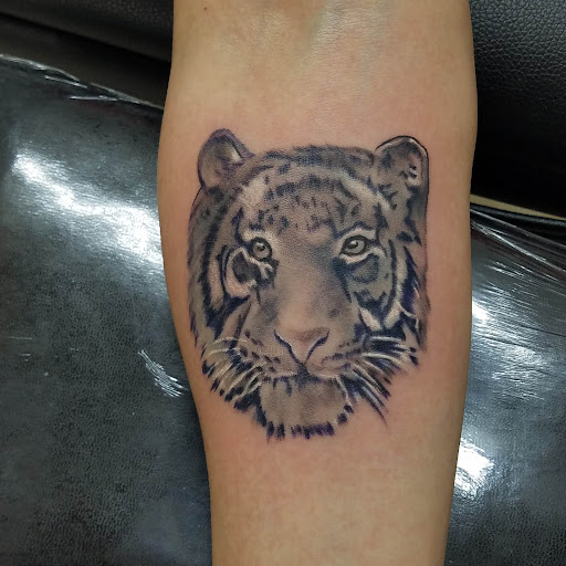 Explore spartan helmet tattoo ideas, creative tattoo ideas in Fresno, available at Fresno Tattoo & Body Piercing