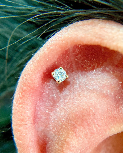 Explore upper leg tattoo ideas, creative tattoo ideas in Orange, available at Symbiosis Body Piercing