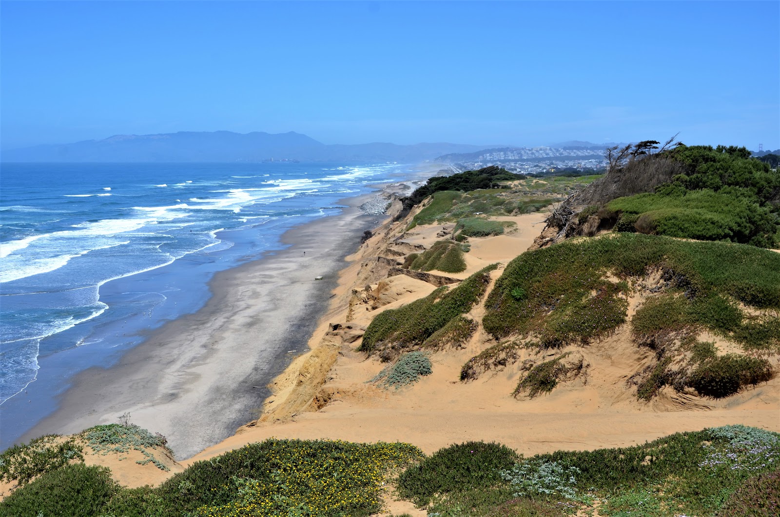 Photo of Funston Beach with bright sand surface
