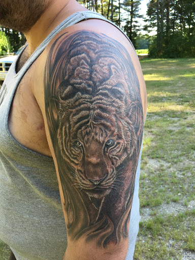 Explore spiral tattoo ideas, creative tattoo ideas in Alfred, available at Utopian tattoo and body piercing