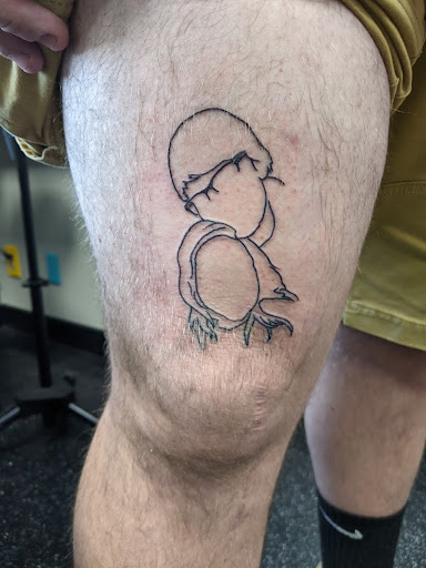 Explore tattoo cover up ideas for upper back, creative tattoo ideas in Slippery Rock, available at Dinky Dachshund Tattoo Parlor