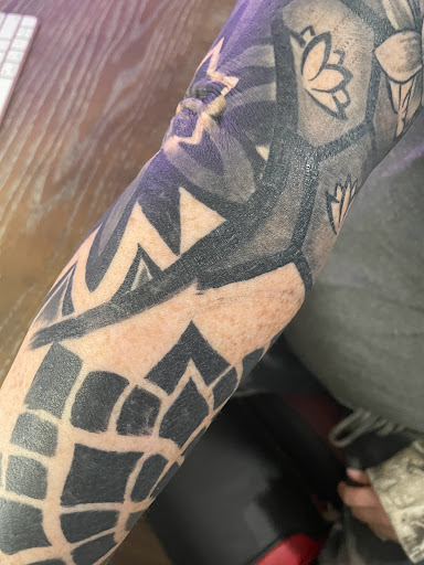 Explore lesbian couple tattoo ideas, creative tattoo ideas in Clarksville, available at Love Blood Ink Tattoo