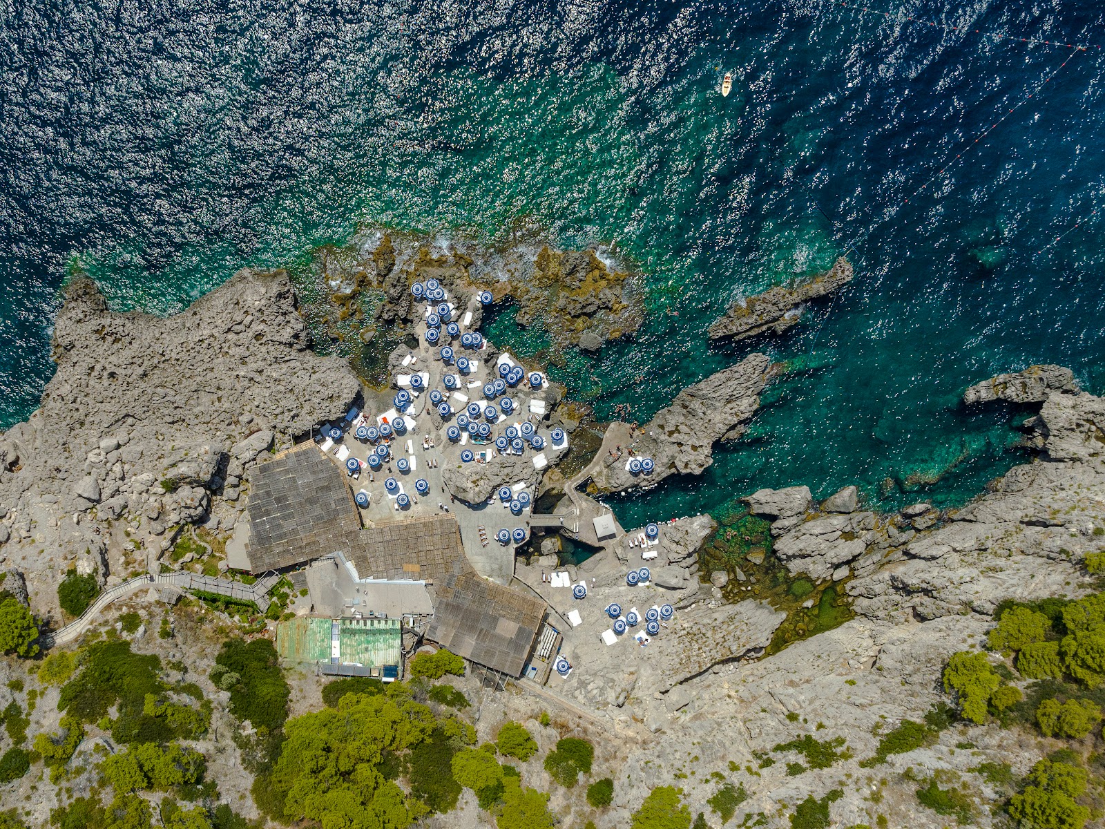 Foto av Spiaggia La Fontelina med blå rent vatten yta