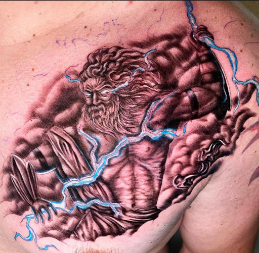 Explore tricep tattoo ideas for men, creative tattoo ideas in Odessa, available at Black Cat Tattoo Company