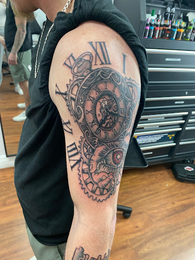 Explore black men tattoo ideas, creative tattoo ideas in Cocoa, available at Rorschach Tattoo Shop and Piercing Studio