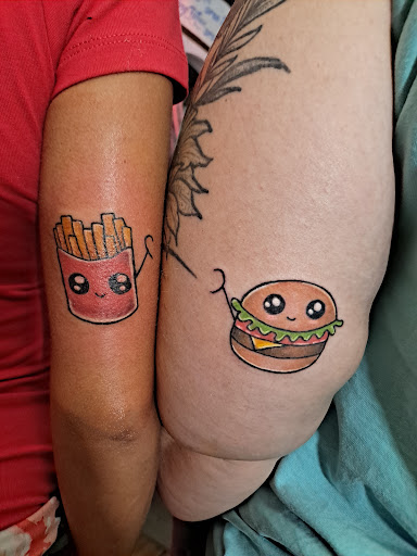 Explore red ink neck tattoo ideas, creative tattoo ideas in Crystal River, available at Americas Best Tattoos