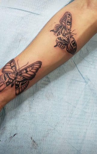 Explore grandfather clock tattoo ideas, creative tattoo ideas in Houston, available at 333 Tattoo Studio HTX