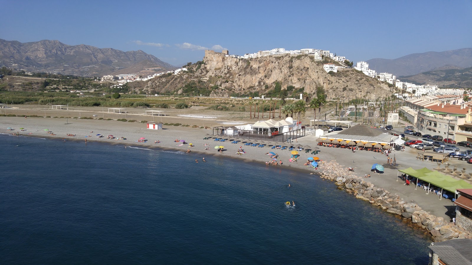 Foto di Playa de la Guardia con una superficie del piccoli ciottoli grigi