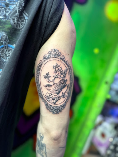 Explore lv tattoo ideas, creative tattoo ideas in Bowling Green, available at The Mad Tatter, L.L.C.