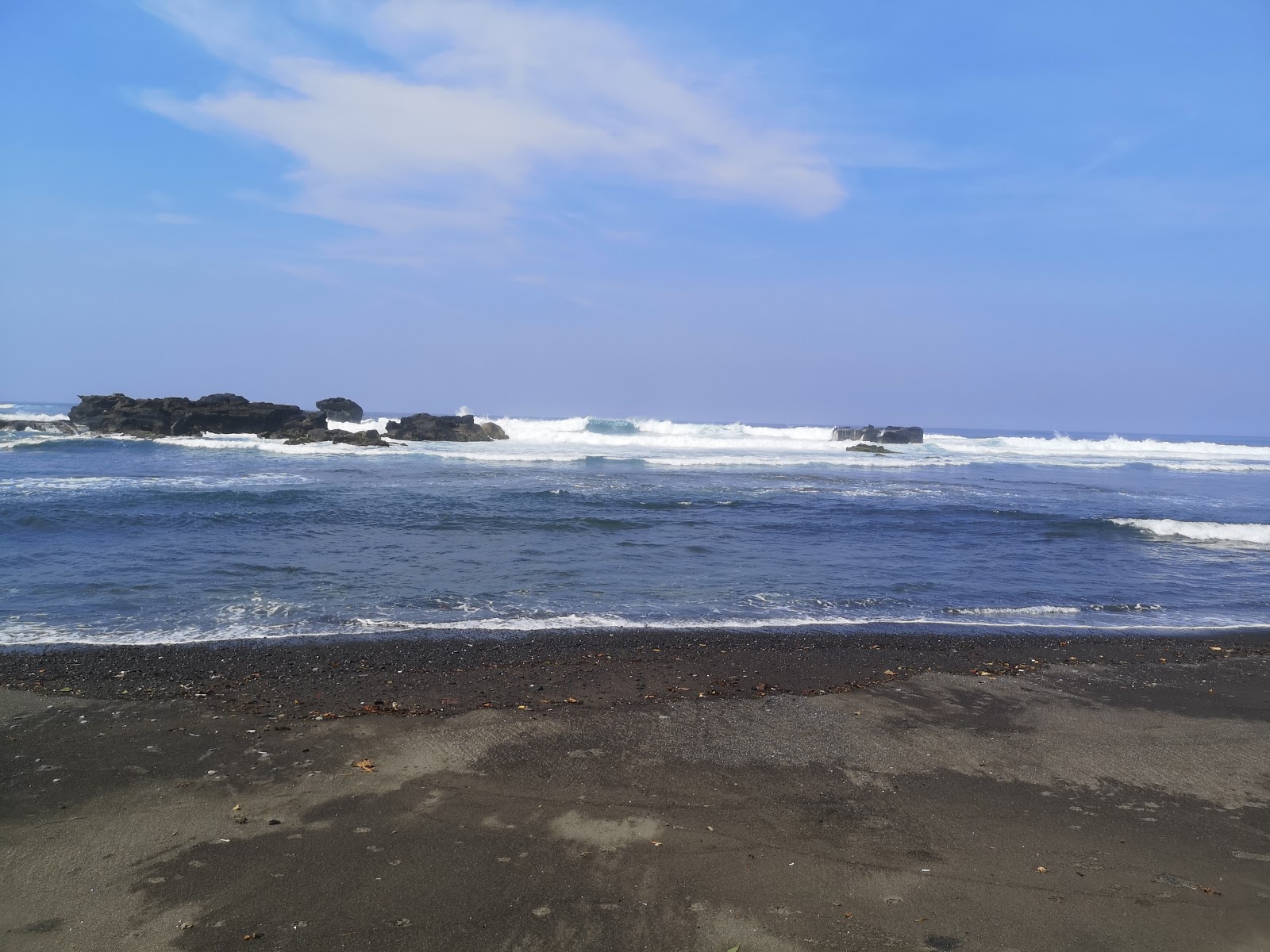 Fotografija Mengening Beach in naselje