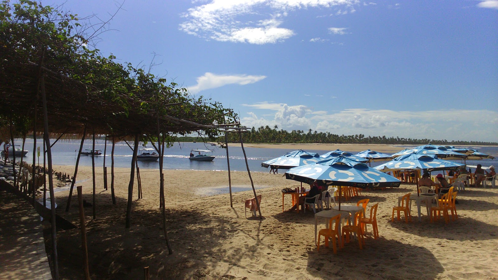 Foto van Strand van Boca da Barra met helder zand oppervlakte