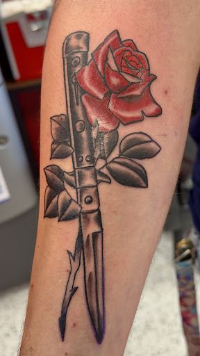 Explore back arm tattoo ideas for guys, creative tattoo ideas in Houston, available at Rose & Dagger Tattoo