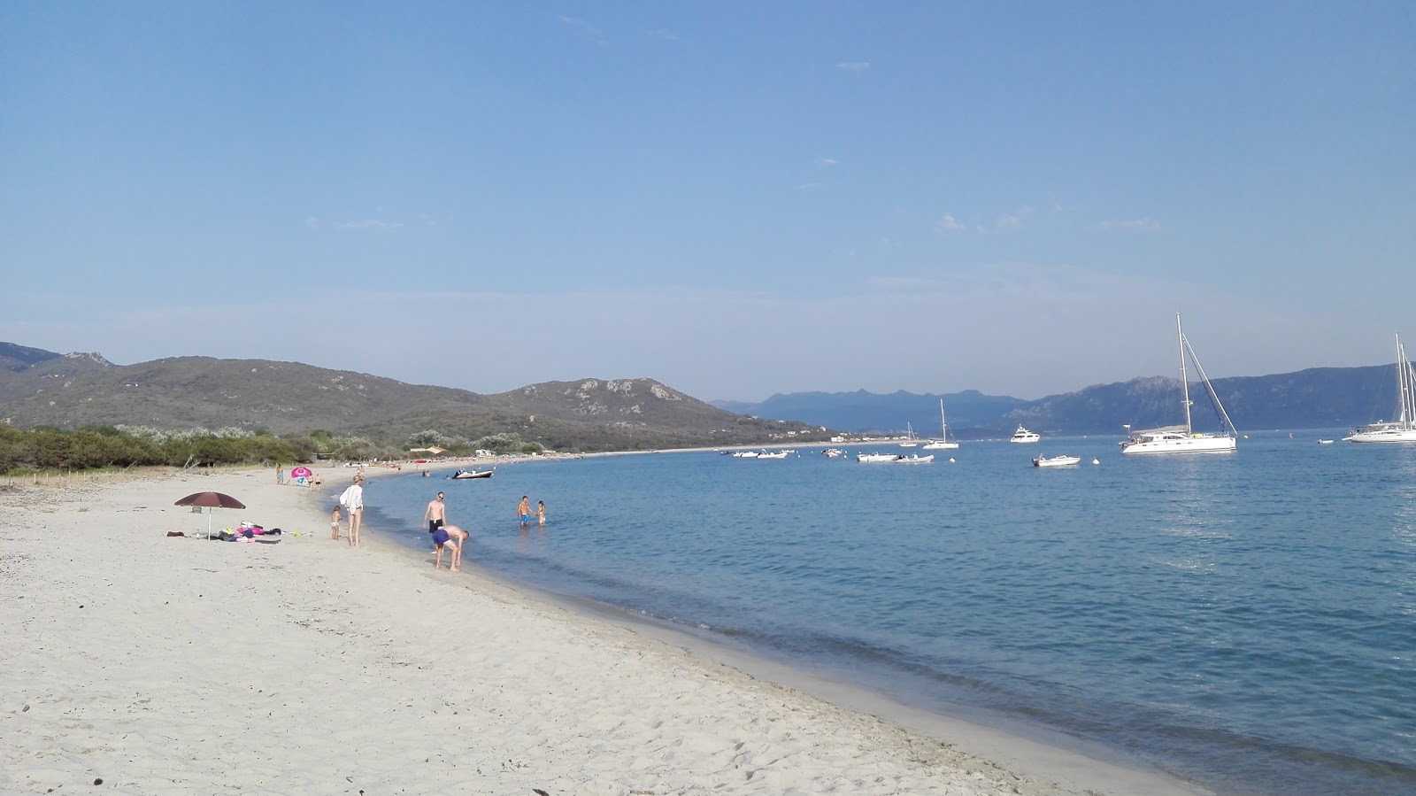 Photo of Caseddu beach with turquoise pure water surface