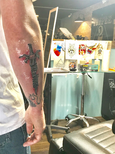 Explore knuckle tattoo ideas for men, creative tattoo ideas in Warrior, available at The Great Wilderness Tattoo