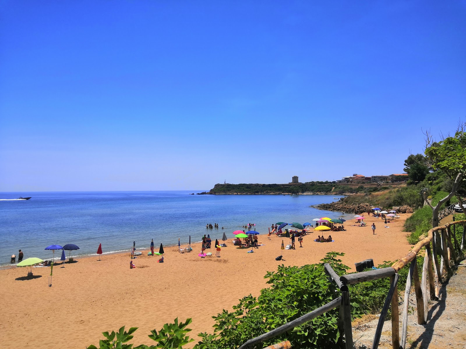 Photo de Spiaggia Rossa avec sable brun de surface