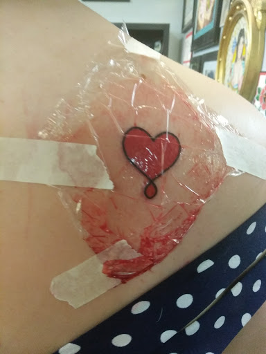 Explore dove tattoo ideas, creative tattoo ideas in Greenville, available at Great Wolf Tattoo