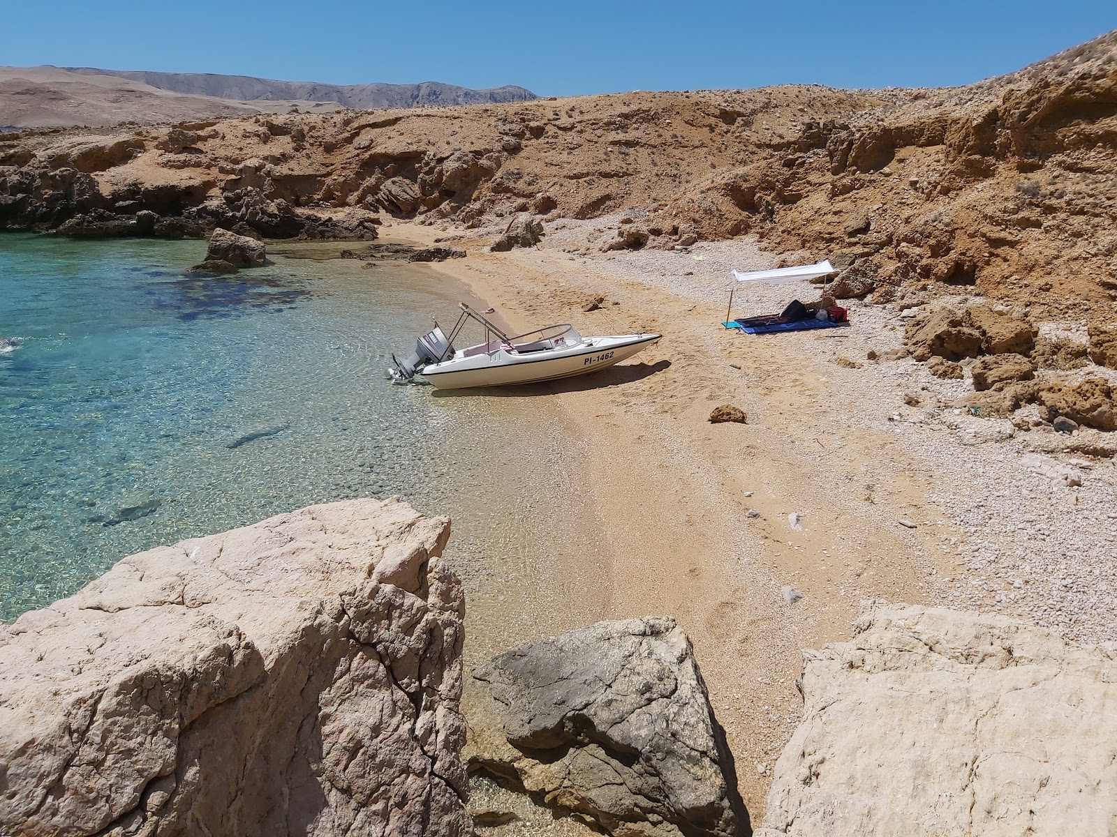 Photo of Mercury beach with light fine pebble surface