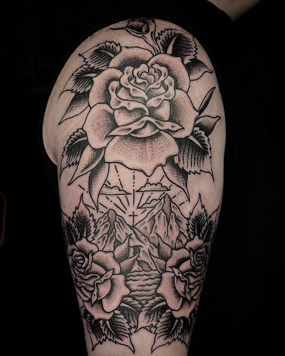 Explore men's dark tattoo ideas, creative tattoo ideas in Johnson City, available at Gold Cross Tattoo Co.