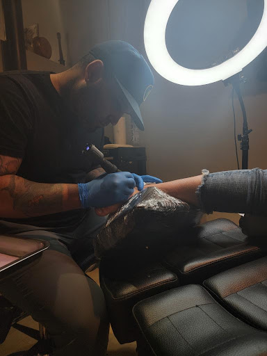 Explore cute dog tattoos ideas, creative tattoo ideas in Fort Wayne, available at Grade A Tattoos and Body Piercing