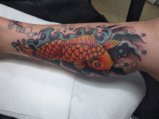 Find owl tattoo ideas for guys for your next unique tattoo in Cranston at Kabloom Tattoo Studio