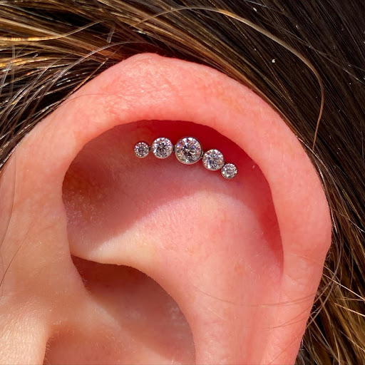 Explore money bag tattoo ideas, creative tattoo ideas in Dover, available at Agap Body Piercings