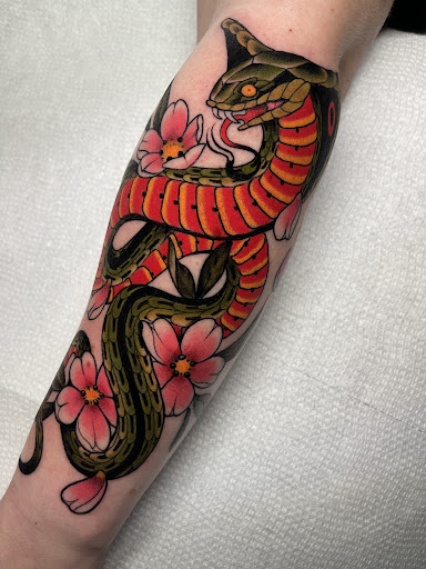 Explore flower spine tattoo ideas, creative tattoo ideas in Naugatuck, available at Tooth And Nail Tattoo