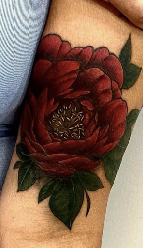 Explore tattoo ideas for women's lower back, creative tattoo ideas in Rowlett, available at Fresh Image Tattoo Studios