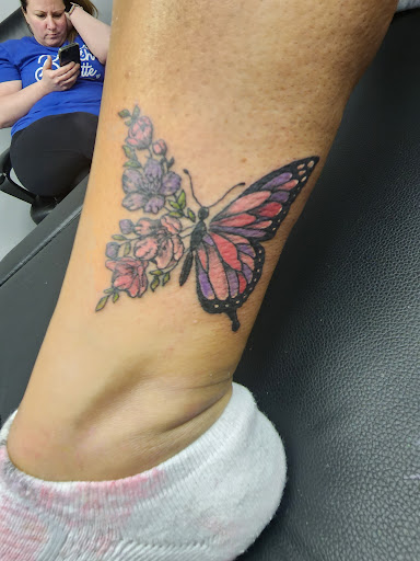 Explore cross forearm tattoo ideas, creative tattoo ideas in Sioux City, available at Tattoo Monkey
