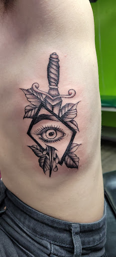 Explore loyalty over love tattoo ideas, creative tattoo ideas in Lima, available at White Wizard Tattoo & Body Piercing