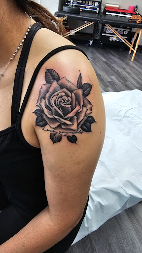 Find women's rib tattoo ideas for your next unique tattoo in Saint Paul at Olmeca Tattoo
