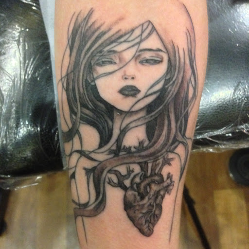 Explore scroll tattoo ideas, creative tattoo ideas in Ithaca, available at Artistic Point Tattoo Company