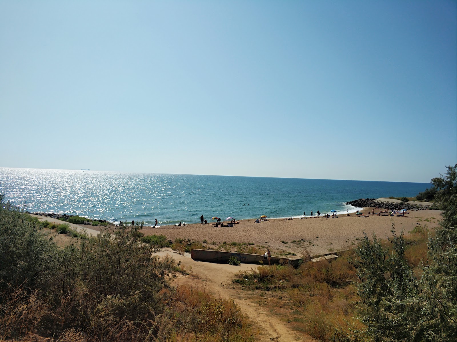 Photo of Plyazh Yuvileynyy with green pure water surface