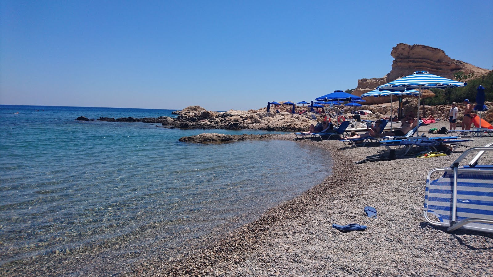 Grande Blue Beach'in fotoğrafı dağlarla çevrili