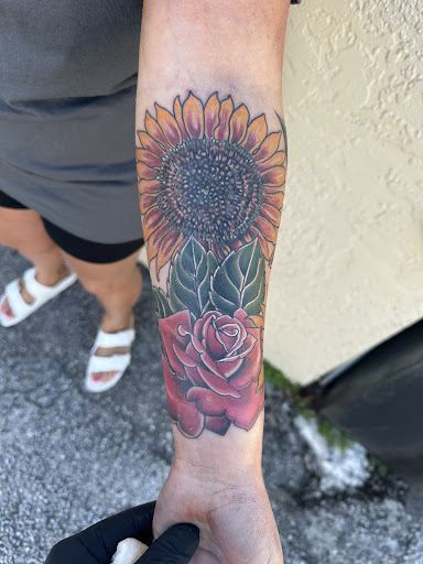 Explore last name back tattoo ideas, creative tattoo ideas in Naples, available at Webbworks Tattoo Studio