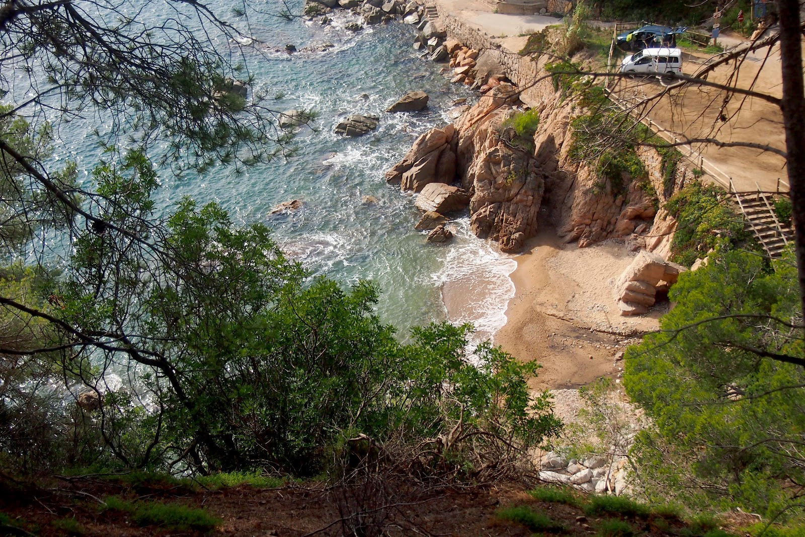 Photo of Cala Llevado with brown sand surface