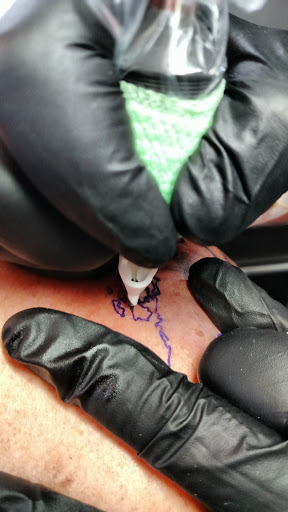 Explore tattoo ideas behind the ear, creative tattoo ideas in Troy, available at The Factory Tattoo