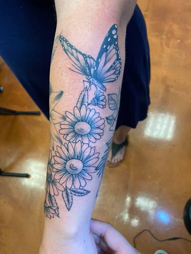Find under breast tattoo ideas for your next unique tattoo in Aledo at Elevated Tattoo & Piercing