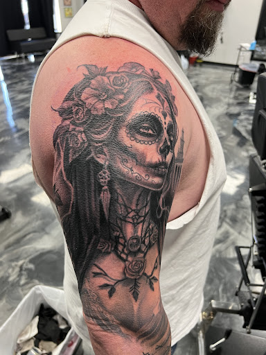 Explore flower shoulder tattoo ideas, creative tattoo ideas in Fayetteville, available at Sacred Raven Tattoo Shop