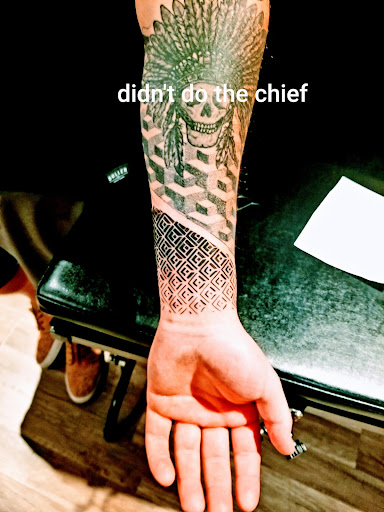Explore book dragon tattoo ideas, creative tattoo ideas in Covington, available at River Ratz Tattoo