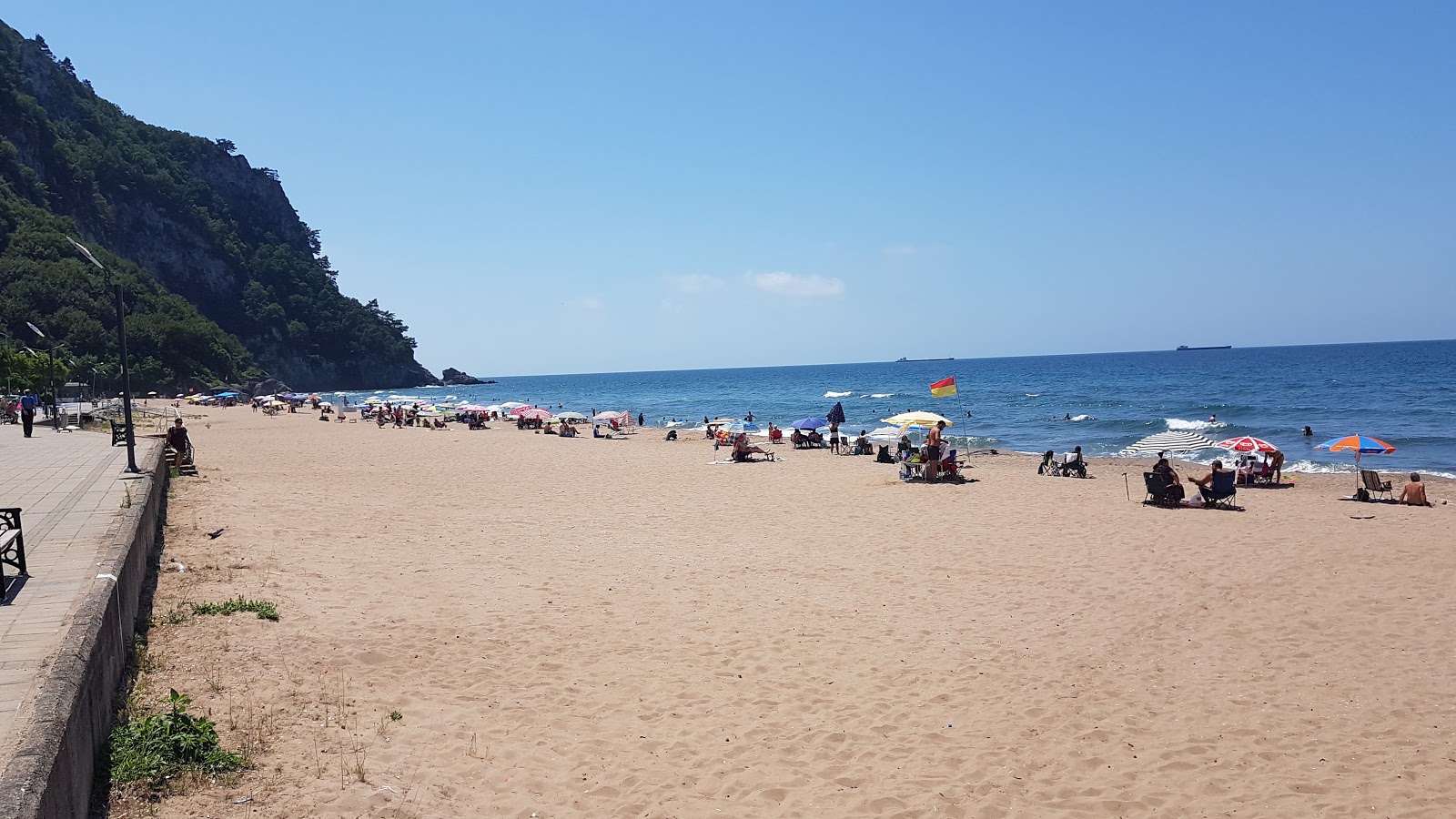 Foto van Inkumu Strand met recht en lang