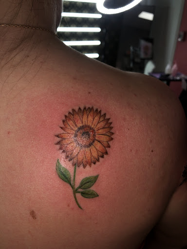 Explore neck tattoos for men ideas, creative tattoo ideas in North Tonawanda, available at Dark Side Ink Tattoo Studio