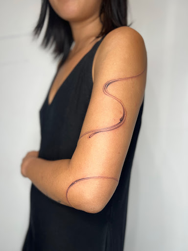 Explore snake tattoo ideas for men, creative tattoo ideas in Beacon, available at Distortion Society Art Gallery Tattoo Studio