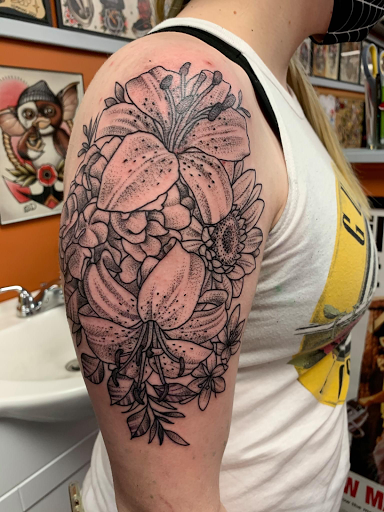 Explore female thigh tattoo ideas, creative tattoo ideas in Hazard, available at Lost Gypsy Tattoo