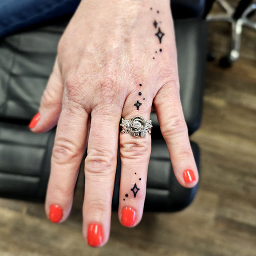 Explore dainty spine tattoo ideas, creative tattoo ideas in Traverse City, available at Pinups & Needles