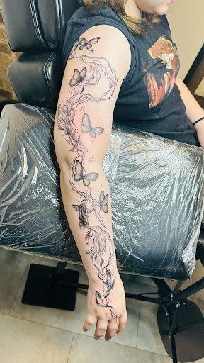 Explore atom tattoo ideas, creative tattoo ideas in Marietta, available at Sink or Swim Studio and Gallery