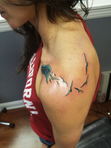 Explore behind neck tattoo ideas, creative tattoo ideas in Birmingham, available at Classic 13 Tattoo