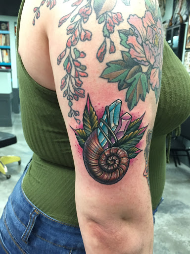 Explore ring tattoo ideas for couples, creative tattoo ideas in Orange, available at Black Palm Tattoo