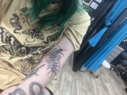 Explore men's family sleeve tattoo ideas, creative tattoo ideas in Buford, available at Wild Tribe Tattoos and Piercings